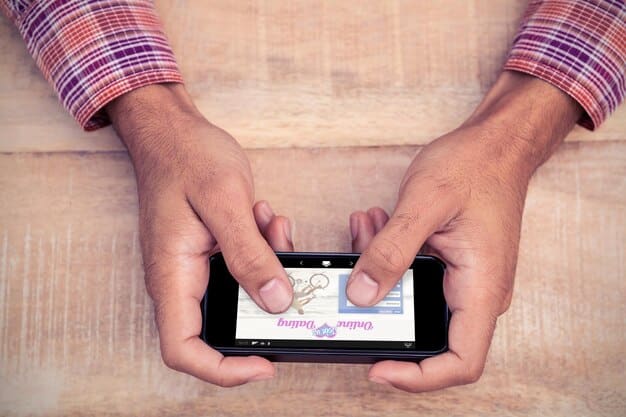A close-up shot of a hand holding a mobile phone displaying a money transfer app with Bangladeshi currency symbols, illustrating the ease and accessibility of sending remittances.