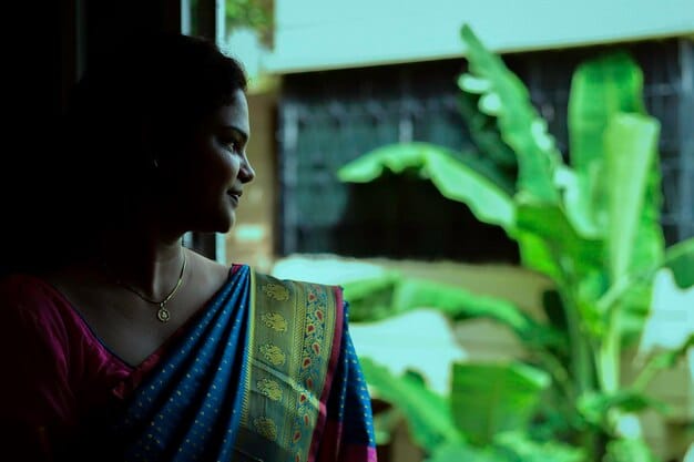 A Bangladeshi woman entrepreneur receiving a microloan from a local bank. The image should highlight the importance of financial support for SME development.