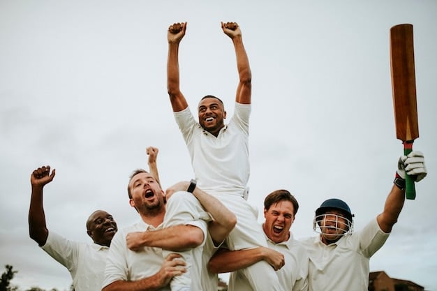 A cricket team celebrating a successful wicket during a match. The spin bowler is being congratulated by teammates, and the coach is seen smiling in the background.