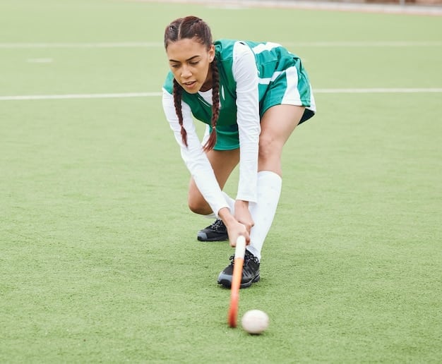 Action shot of a key player from the Bangladesh hockey team dribbling the ball skillfully down the field during an international match, with opponents in pursuit and focused expressions on their faces.