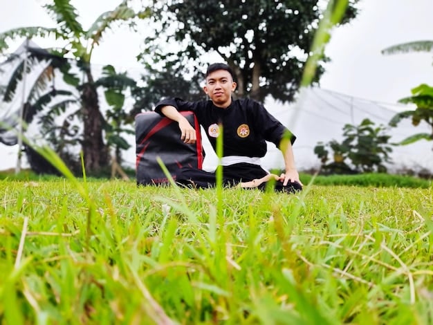 A dynamic shot of a football coach in Bangladesh demonstrating a specific football technique to a group of young players during a training session. The image should focus on the coach's expertise and the players' engagement, highlighting the importance of quality coaching in grassroots development.