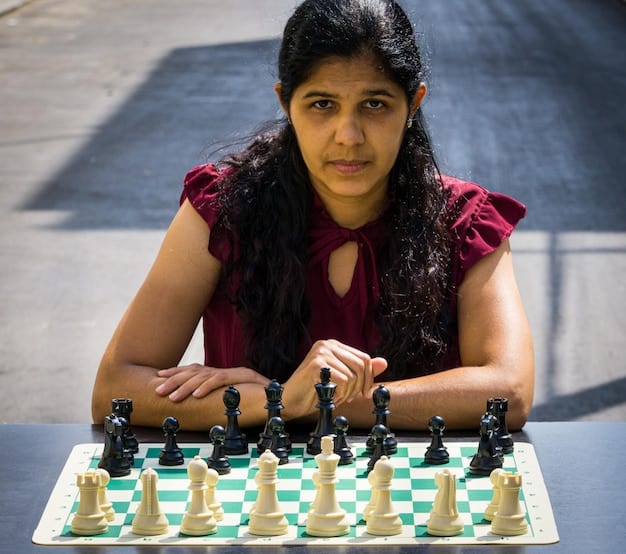 A young female chess player from Bangladesh receiving an award for her performance in a national chess championship, with a look of pride and determination on her face.