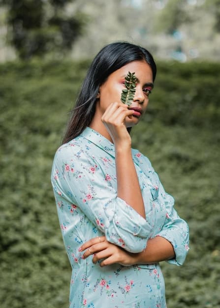 A young Bangladeshi woman is wearing a stylish and comfortable organic cotton dress in a natural setting, highlighting the trend of eco-friendly fashion.