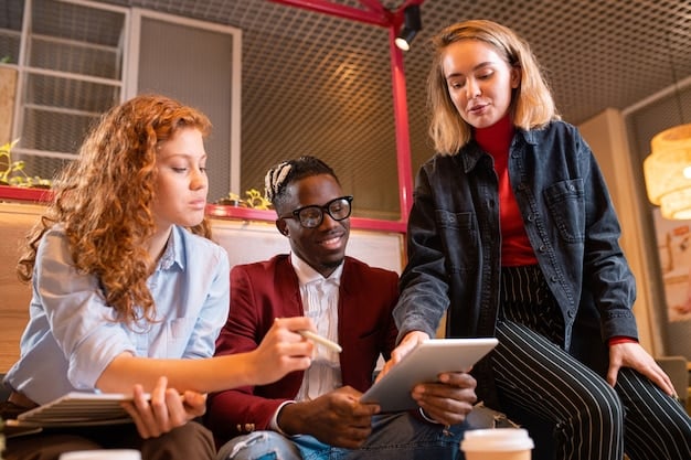 A diverse group of students working collaboratively on a project using tablets and other technological devices, emphasizing the shift towards technology-integrated learning in the new education policy.